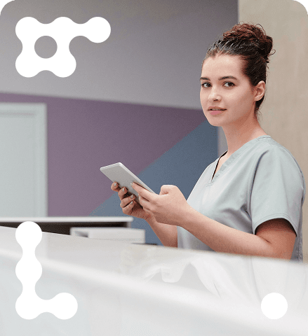 Healthcare professional with tablet in a modern medical office